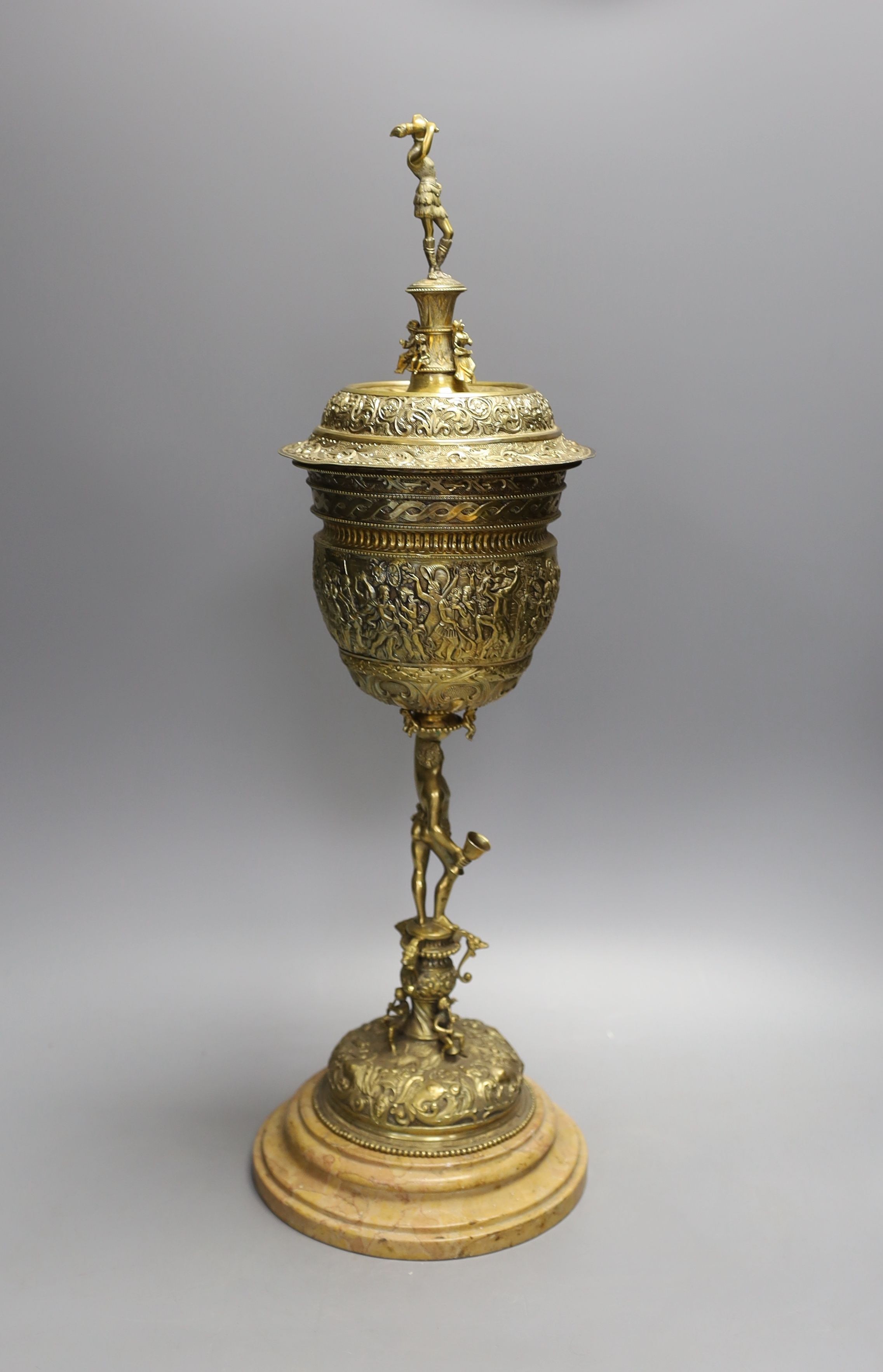 A decorative Bacchus electrotype chalice and cover on stone base - 49cm high